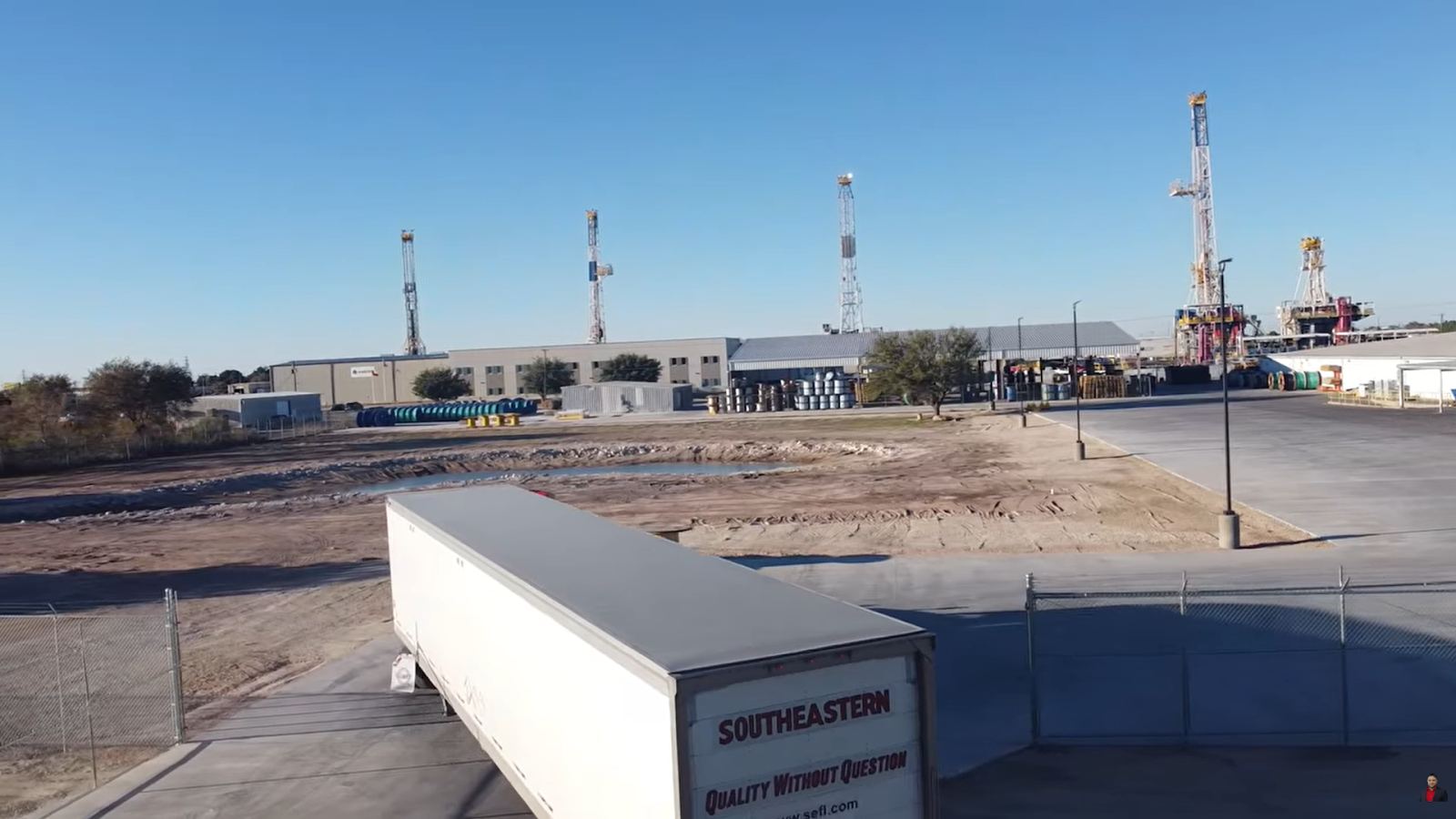 Industrial site with a trailer under a clear sky